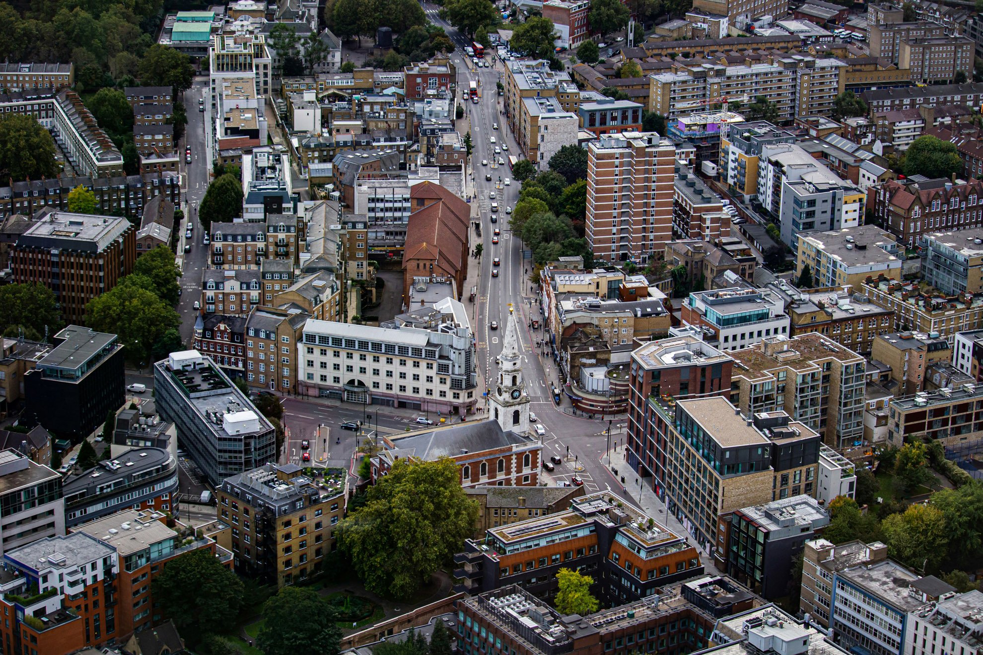 This is a picture of an aerial view of a junction in London. The picture features residential high-rise buildings, which would be classed as a High Risk Building under the new Building Safety Act and is subject to the Building Safety Regulator regulations.