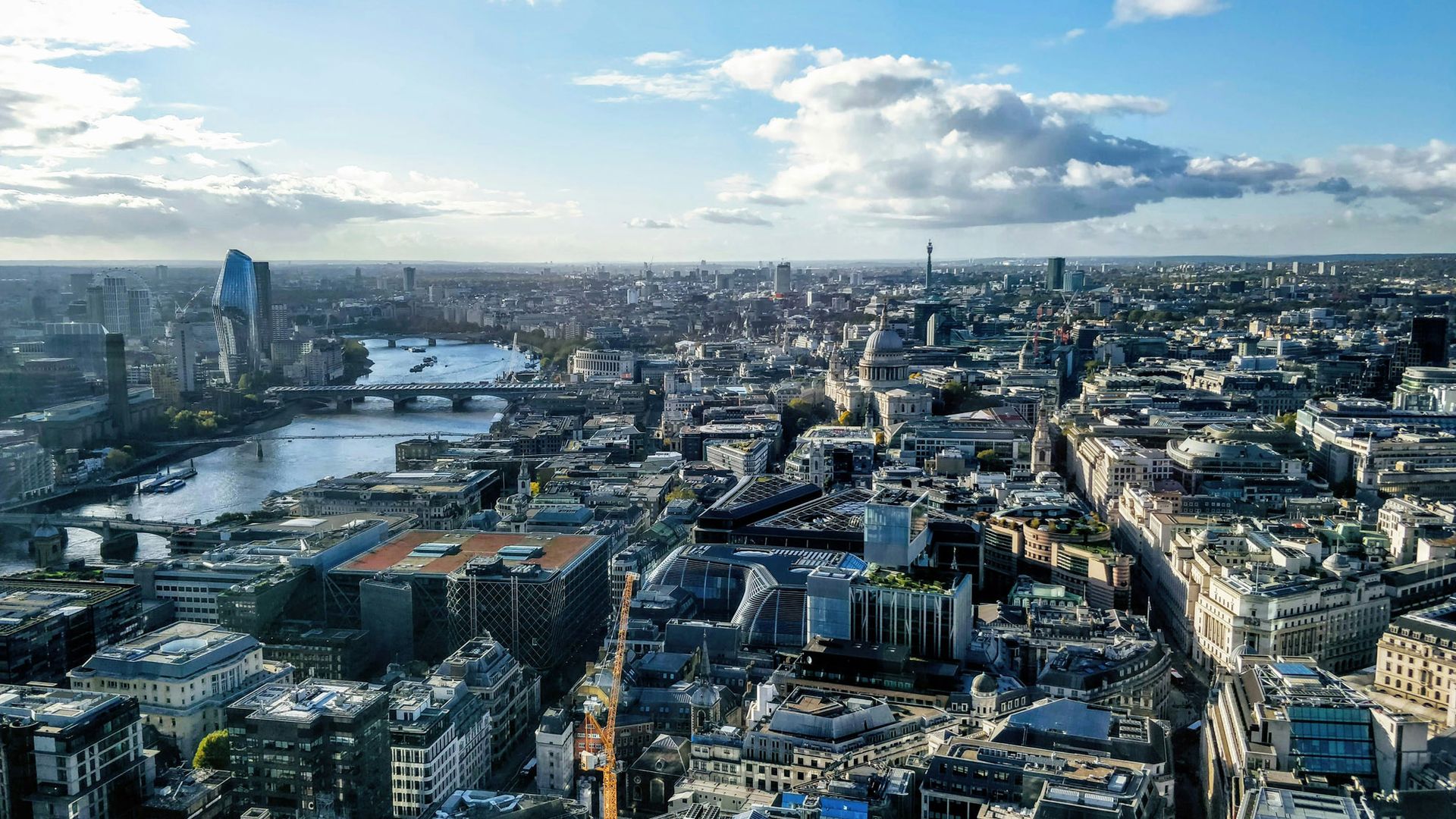 This is a picture of an aerial view of buildings in London. The picture features residential and commercial high-rise buildings, which would be classed as a High Risk Building under the new Building Safety Act and is subject to the Building Safety Regulator regulations.